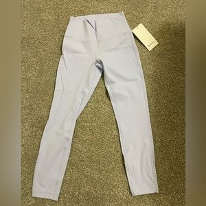 Never worn with tags Wunder Under HR Tight 25”